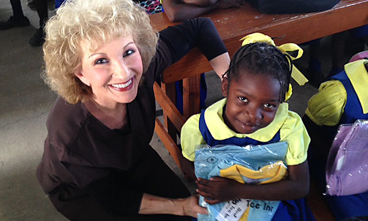 Sherry Burnette and a child in Love A Child's Sponsorship program in Haiti