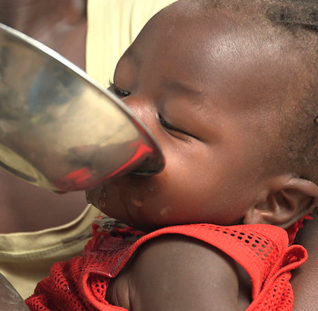 Thirsty child drinks water loaded with waterborne illnesses