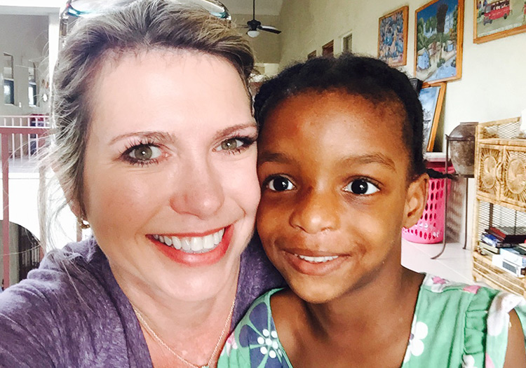 Julie with orphan Rodna at Love A Child Hope Center Orphanage.