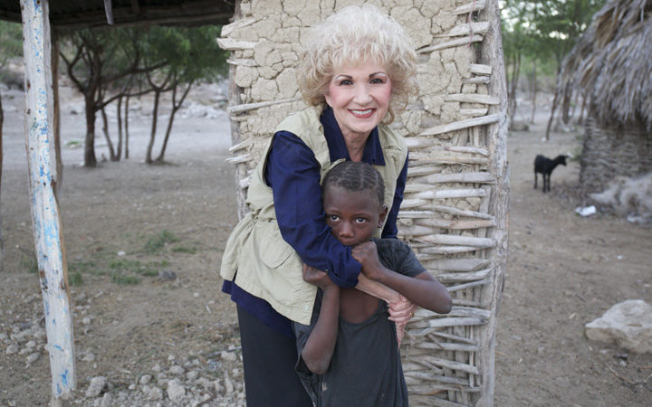 Sherry Burnette with a child in Haiti