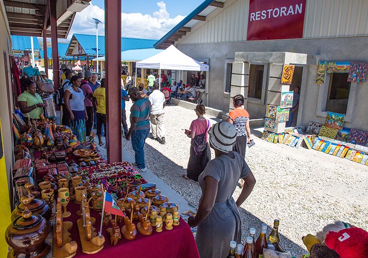 This marketplace is booming and we are so thankful that Haitians are working.