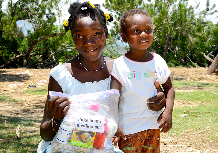 Haitian woman receives family pack of medicine to take home!
