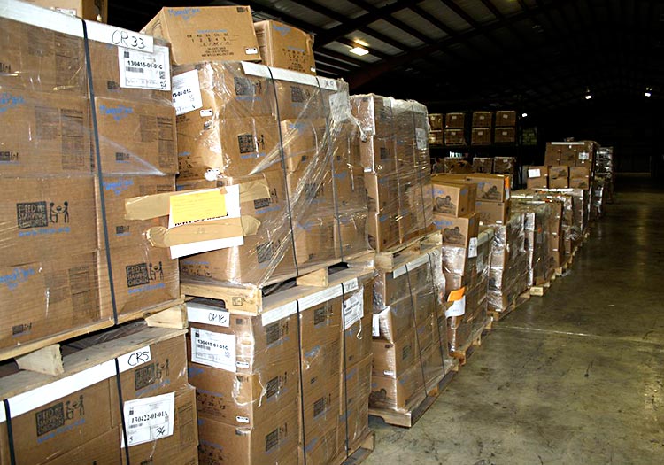 Stacked boxes of food inside warehouse.