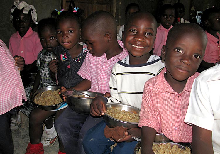 Schoolchildren fed a hot, nutritious meal every day.