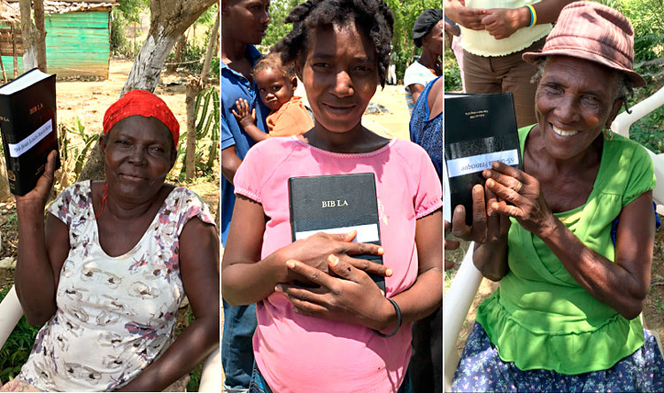 Three woman receive Bibles in Sapaterre.
