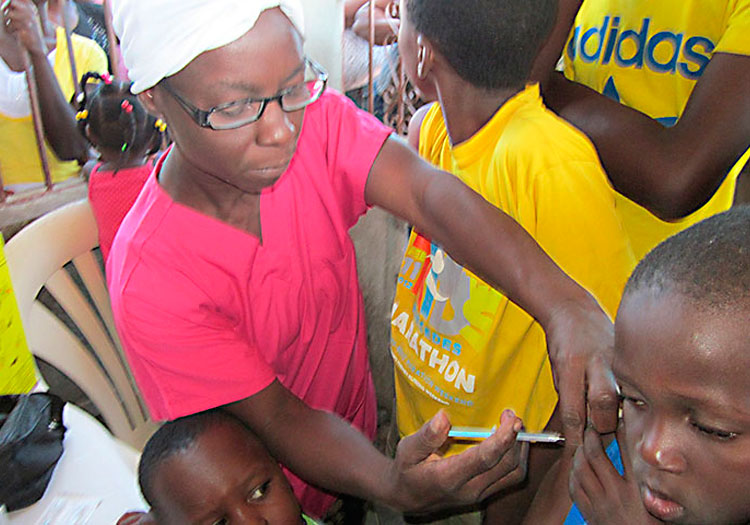 Community health care in Haiti includes vaccinations.