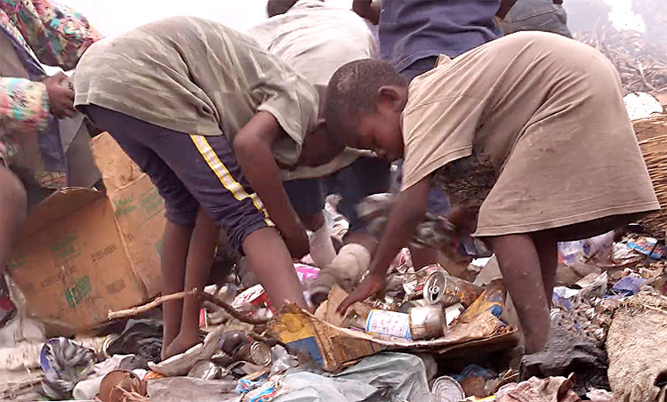 These starving children scavenge through the garbage every day for a morsel of food.