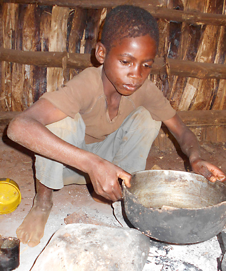 Haitian child cooking
