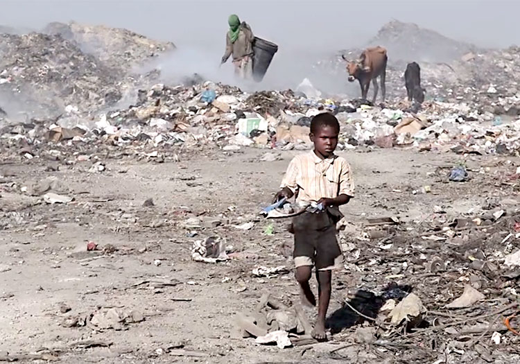 A young child working in the Truttier Dump site.
