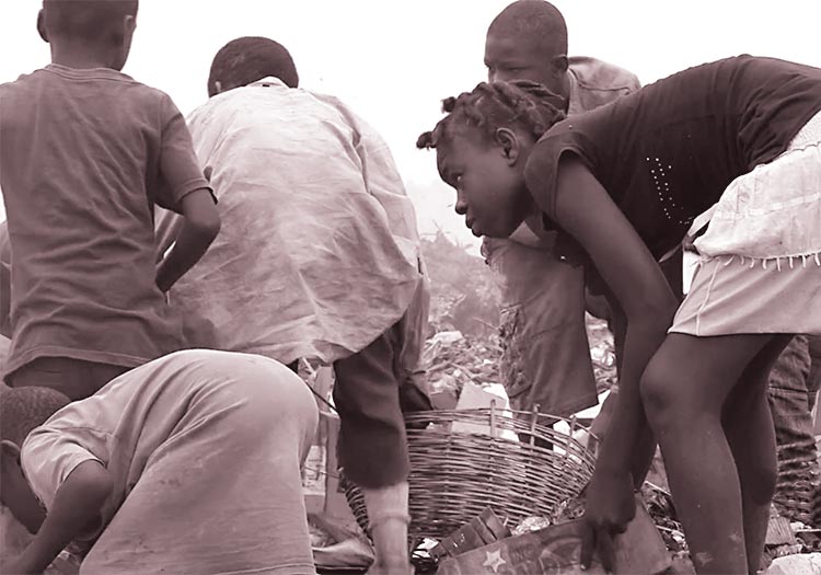 Children are scavenging through the garbage at the Truttier Waste Disposal Dump