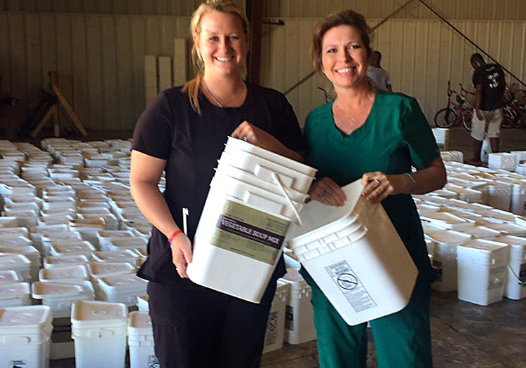 Kaeli and Julie getting disaster relief buckets ready.