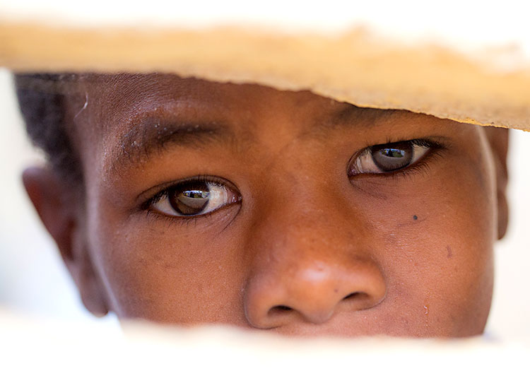 Young Haitian boy in despair after Hurricane Matthew.