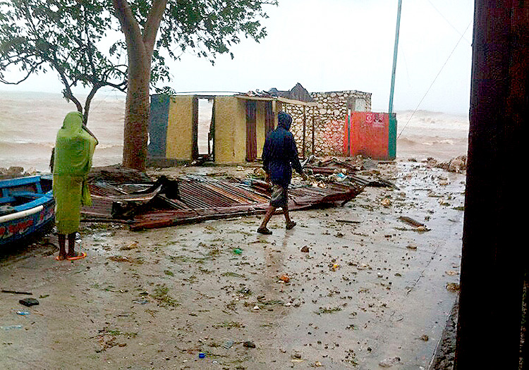 Damaged homes and coastal flooding in Haiti