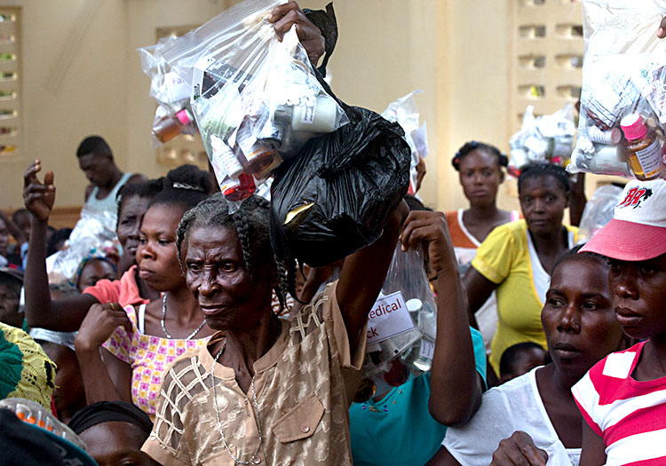 Haitian families receive Family Medical Packs.