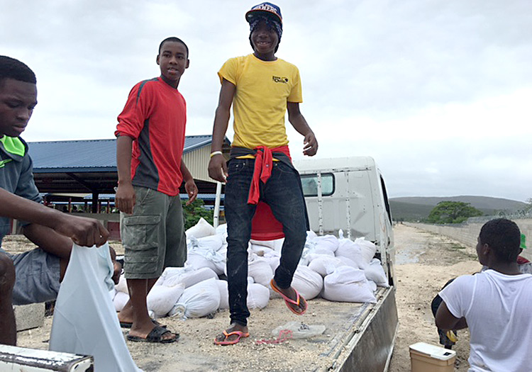 Love A Child Orphans fill sandbags