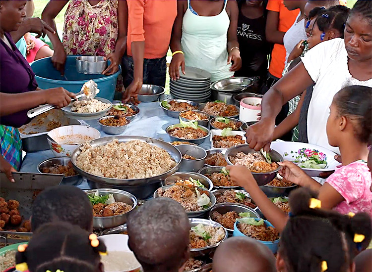 Feeding malnourished children in Haiti after the hurricane.