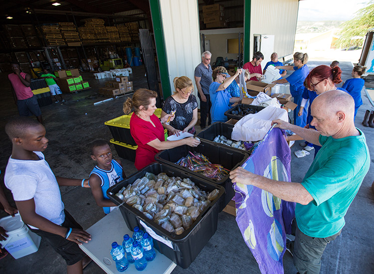 Volunteers packing Disaster Relief buckets