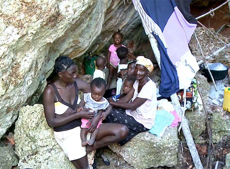 Haitian families inside caves.
