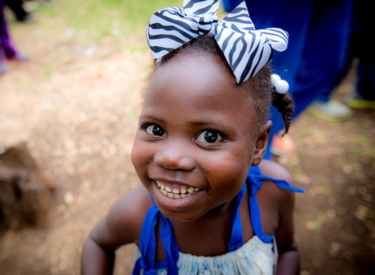 Child Sponsorship - happy young Haitian girl