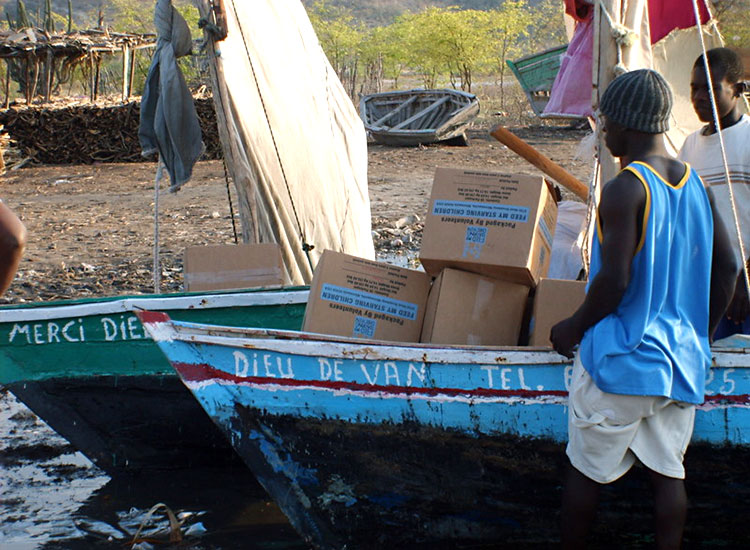 Picking up their food by boat in Letant, Haiti