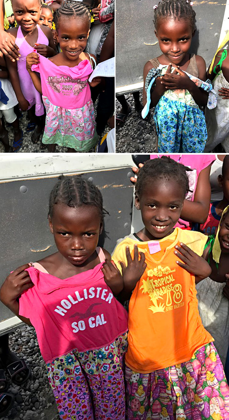 Precious Haitian children receive a donation of handmade dresses.