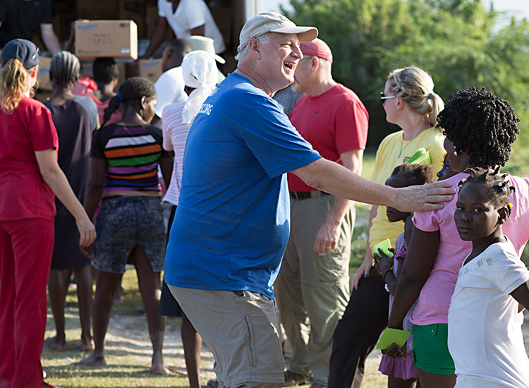 Mark Crea and his FMSC volunteer team help distribute food in Despeezo, Haiti.