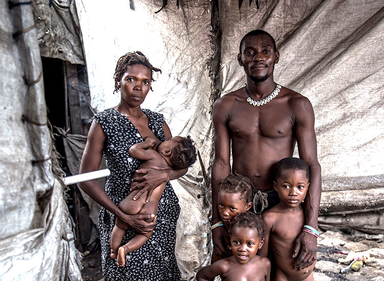This family is one of the many living in the garbage dumps of Cité Soleil