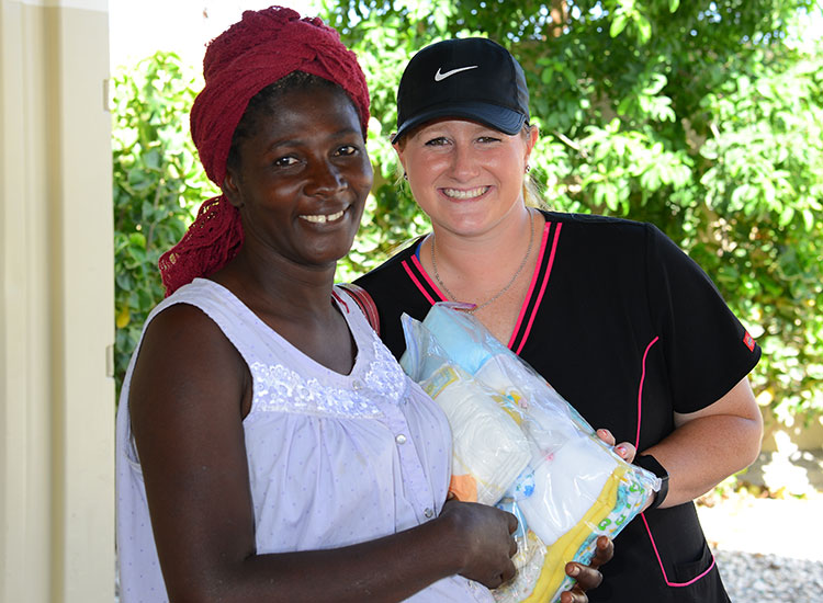 Kaeli brings Birthing Kits and baby clothes to the soon-to-be mothers