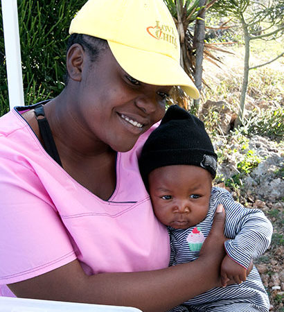 Mobile Medical volunteer with Haitian baby.