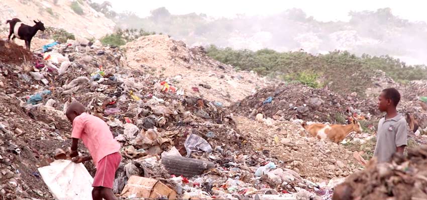 Children are living in the garbage dumps in the slums of Cité Soleil scrounging for food.