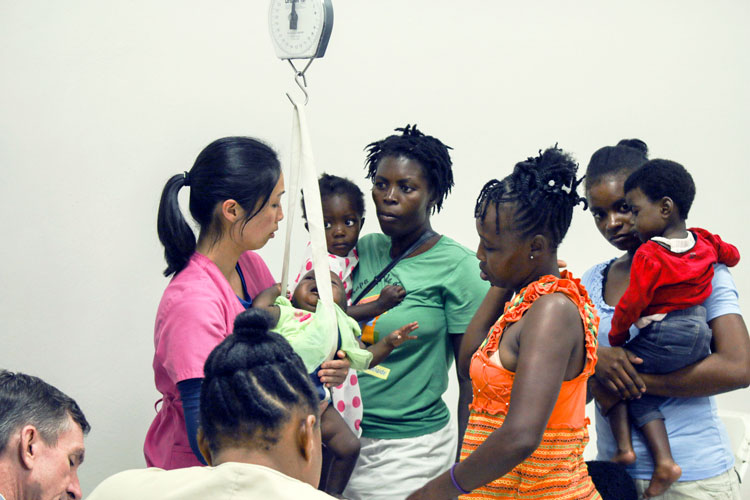 Babies being weighed in at the Malnutrition Center.