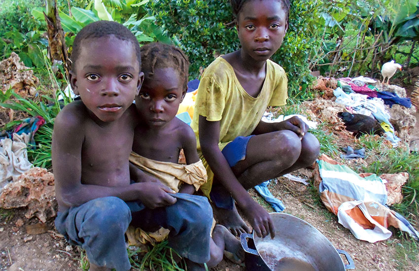 Poor Haitian children needing food and clothing.