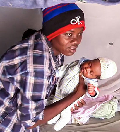 New baby born in mud hut in Haiti.