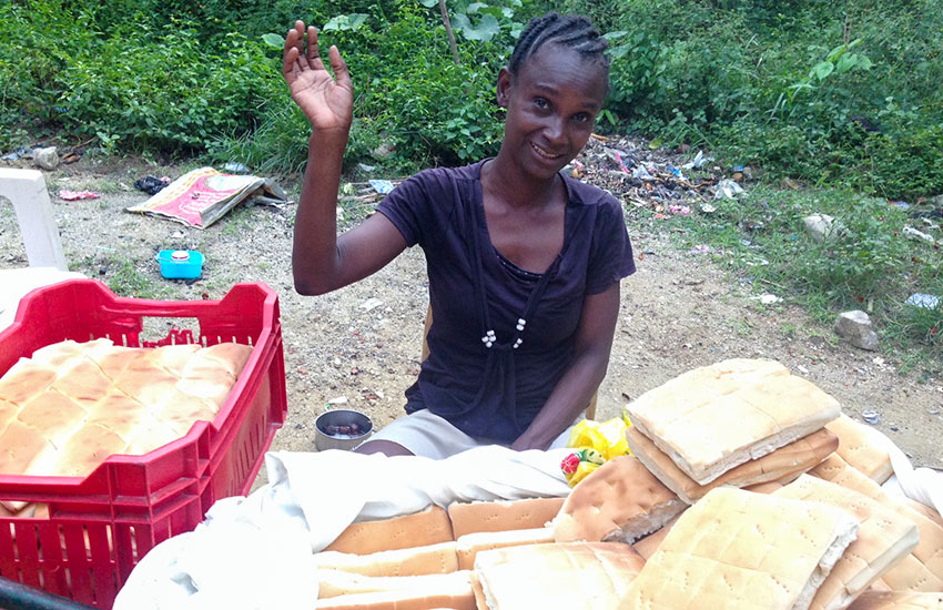 Haitian woman has a new business making and selling bread.