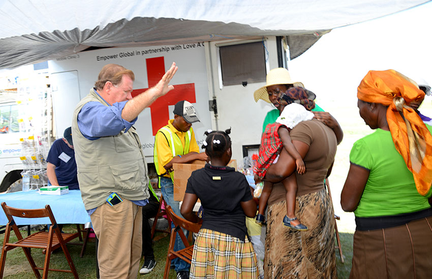 Bobby praying over this family in Despeezo.