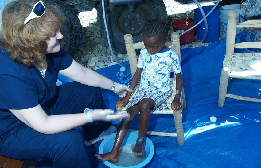 Young child receiving wound care.