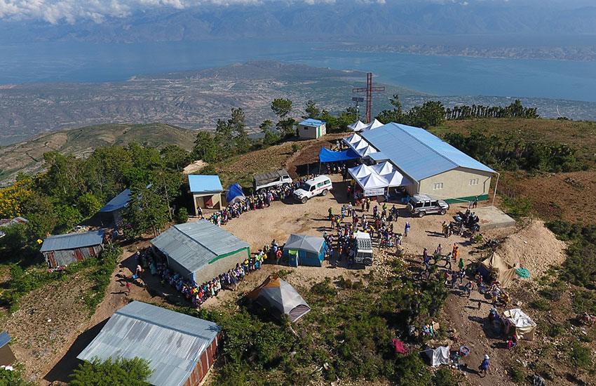 People line up for a Mobile Medical Clinic on top of the mountain in Peyi Pouri.